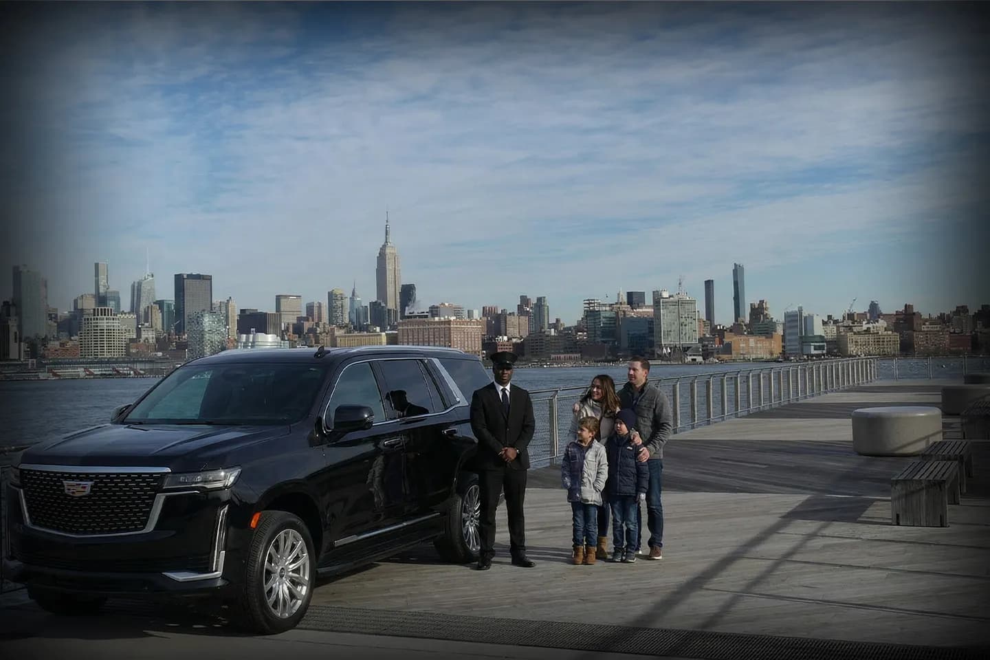 Professional chauffeur opening car door in New York City