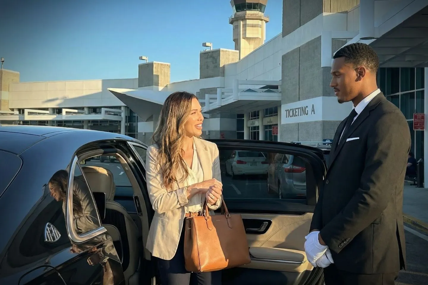 Professional driver assisting passenger in premium Florida, FL Car Service vehicle