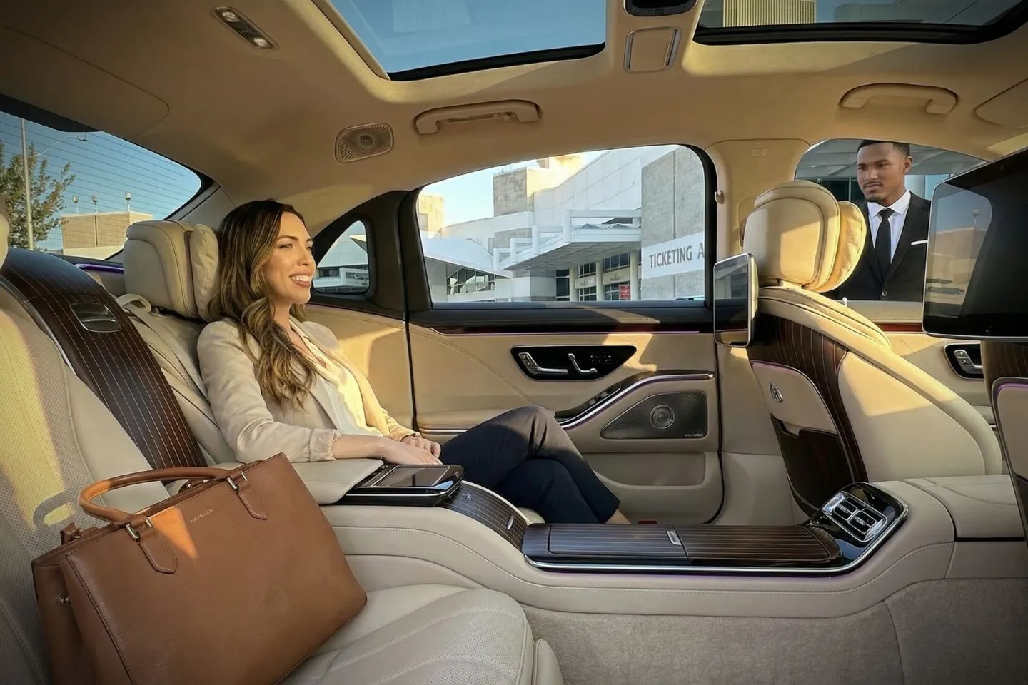 Black SUV offering Florida, FL Car Service parked outside upscale hotel