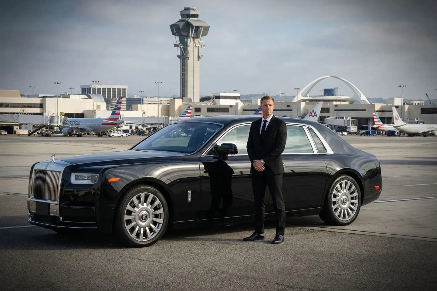 LBE Car Service chauffeur assisting passenger at LAX terminal