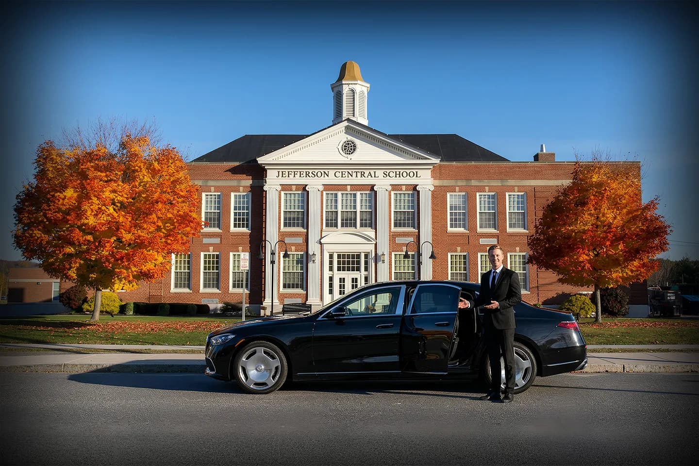 Chauffeur Service in Jefferson, NY Chauffeur opening car door in Jefferson NY for premium private car service client